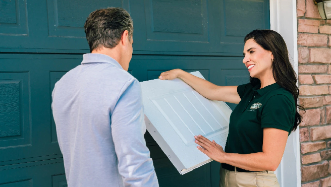 Precision Garage Door technician fixing a garage door opener